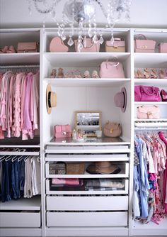 an organized closet with pink and white accessories