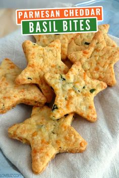 cheesy crackers with parmesan cheese and spinach are on a plate