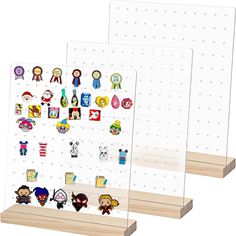 two clear acrylic pegboard displays with various stickers on each one and the other