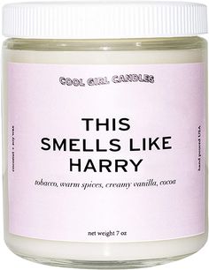 this smells like harry candle is in a jar with white lid and pink lettering on it