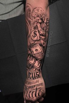 a man's arm with tattoos on it and money coming out of his hand