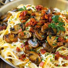 pasta with mushrooms, bacon and parmesan cheese in a pan