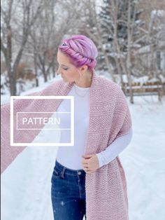 a woman with pink hair is standing in the snow wearing a cardigan and jeans