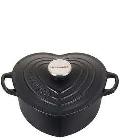 a black pot with a heart shaped lid