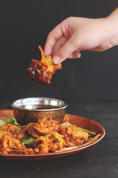 a person is dipping some food into a bowl with other foods in it and the caption reads, where everything at tea comes from