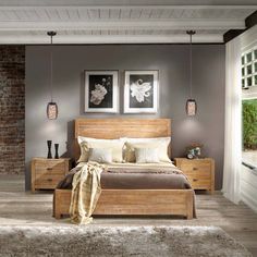 a bed room with a neatly made bed and two pictures on the wall above it