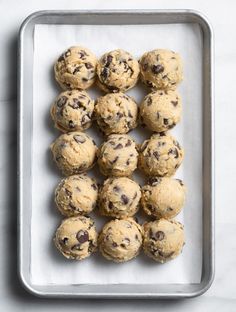 chocolate chip cookie dough balls on a baking sheet