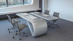 an empty conference room with desks and chairs in front of a large window overlooking the city