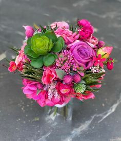 a bouquet of flowers sitting on top of a table