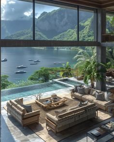 a living room filled with lots of furniture next to a large window overlooking the ocean