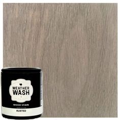 a can of weather wash wood stain sitting on top of a wooden flooring board