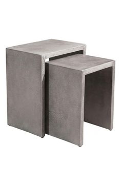 two square concrete tables sitting next to each other