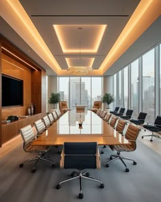 an empty conference room with chairs and a large table in front of a window overlooking the city