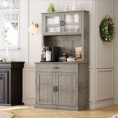 a gray hutch sitting on top of a hard wood floor