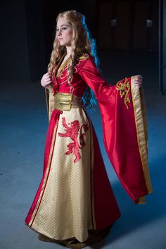 a woman in a red and gold costume