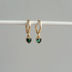 Dainty Emerald Green Heart Charm Huggie Hoop Earrings,  Gold Plated Earrings, Vintage Style Earrings, Victorian Earrings  Product specifications: * Material: 14K Gold Plated Brass * Size Each charm measures 0.7cm cm x 0.5 cm Earring Options: * 8mm inner diameter leverback hoops (1.1cm outer diameter, 1.5cm drop) * 10mm inner diameter leverback hoops (1.3cm outer diameter, 1.6cm drop) Packaging and Gifts: * All pieces of jewellery are sent in a mesh jewellery pouch with a thank you card.  Shippin Green Dainty Huggie Jewelry, Dainty Green Huggie Hoop Earrings, Elegant Green Dangle Huggie Earrings, Elegant Emerald Huggie Hoop Earrings, Green Emerald Huggie Earrings, Victorian Earrings, Vintage Style Earrings, Green Heart, Huggie Hoop Earrings