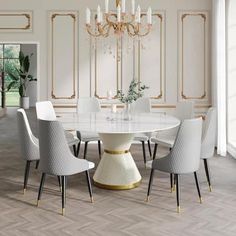 a dining room table with white chairs and a chandelier