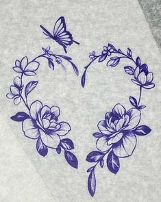 a white sheet with blue flowers and butterflies on it