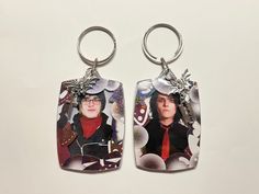 two key chains with pictures of the same person on them