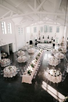 an indoor banquet hall with tables and chairs