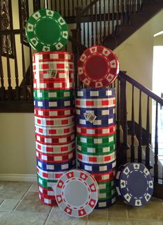 stacks of poker chips sitting on top of each other in front of a stair case