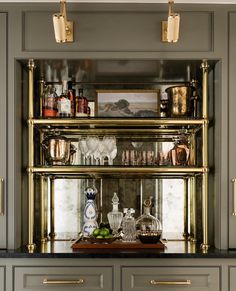 the shelves in this kitchen are filled with glassware