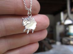 "The cutest sheep necklace ever. This little charm necklace measures about 1/2\" tall and is made using solid sterling silver in my California workshop. Choose your chain style and length from the drop down menus. For the larger version go here: http://www.etsy.com/listing/60616656/fluffy-little-sheep For the matching earrings go here: http://www.etsy.com/listing/68400751/fluffy-the-sheep-earrings For the Mother-Daughter Set go here: http://www.etsy.com/listing/67923370/mother-daughter-fluffy-ne Sheep Necklace, Word Girl, Idea Style, Cute Sheep, Charm Necklace Silver, Silver Jewelry Handmade, Necklace Silver, Chain Styles, Matching Earrings