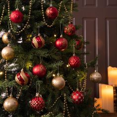 a christmas tree with red and gold ornaments