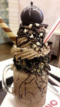 an ice cream sundae is topped with chocolate and sprinkles on top