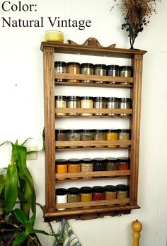 a wooden shelf filled with jars and spices