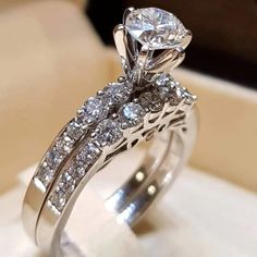 a close up view of a diamond ring on display