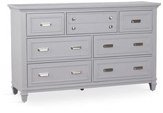 a large gray dresser with drawers on each side