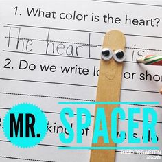 a hand holding a pencil over a paper with the words mr and mrs spacer on it