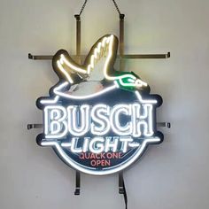 a neon sign hanging from the side of a wall