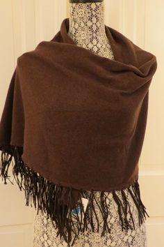 Lovely Portolano Cashmere Fringed Shawl – Chocolate – NWT - $400 A shawl in a classic brown cashmere but with a twist – the shawl has a rectangular body overall but the ends are tapered into a point … AND … the entire lower edge of the shawl has 4” leather fringe! Material: 100% cashmere.  Dry clean.  Dimensions: length – 72” and width – 22”. Brown Shawl Outfit, Off The Shoulder Shawl, One Size Pashmina Shawl For Fall, Brown Pashmina Shawl For Fall, Cashmere Pashmina Shawl For Fall, Traditional Brown Shawl For Winter, Fall Pashmina Shawl, Brown Pashmina Shawl For Winter, Brown Pashmina Scarves For Winter