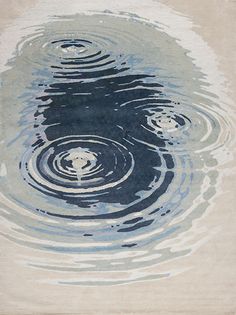 an abstract painting with water ripples on the ground