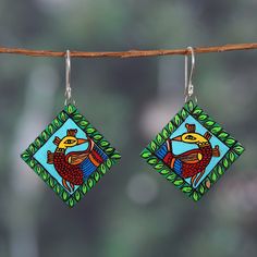 Imitating the luxurious Kalamkari art style, a pair of majestic peacocks decorate Ritu Thapar's homage to India. Local artisans craft these diamond-shaped dangle earrings from ceramic, painting them by hand with a classic regional style that combines vibrant hues in one luxurious composition. As the final touch, sterling silver hooks allow for comfortable wear. Kalamkari Peacock, Kalamkari Art, India Gift, Diy Jewlery, Gift Suggestions, Peacock Green, Green Ceramics, Final Touch, Peacocks