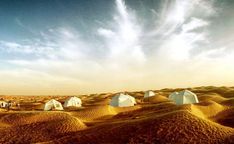 several tents are set up in the desert