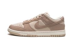 The Women’s Nike Dunk Low “Sanddrift” is a women��’s-exclusive colorway of the vintage basketball shoe that features a versatile appearance.  The “Sanddrift” Dunk Low is complete with a light tan leather base with contrasting dark tan suede overlays and Swoosh branding.  Tonal “Nike” detailing is embroidered onto the heel.  Additional “Nike” branding can be found on the tongue tag.  A Sail midsole and Sanddrift rubber outsole put the finishing touches on the design.  Release date: March 4, 2023 Womens Dunk Low, Wmns Dunk Low, Shoe Palace, Retro Basketball Shoes, Nike Branding, Preppy Shoes, Vintage Basketball, Streetwear Accessories, Nike Brand