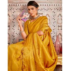 Mustard colored saree is prettified with beautiful weaving work as shown which makes it appear classy. This saree is made of art silk fabric which is accompanied with art silk blouse piece which you can customise as per your design/style. Women can buy this saree to wear for their party, festive, sangeet functions and homely events and ideal for any fashionista. Note:- The actual product may differ slightly in color and design from the one illustrated in the images when compared with computer or mobile screen.