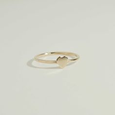 Add a touch of romance and elegance to your jewelry collection with our handcrafted Tiny Heart Ring. Made of high-quality gold filled material, this dainty and minimalist ring features a tiny heart design, perfect for adding subtle yet eye-catching detail to any outfit. Feel the love and beauty whenever you wear this charming ring. Handcrafted in the USA Details Hypoallergenic, Water Resistant, Tarnish-free Material : 14k Gold Filled Promise Rings Simple, Love And Beauty, Dainty Rings, Tiny Rings, Ring Heart, Twisted Band, Pretty Jewelry, Beaded Cuff, Minimalist Ring