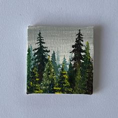 a painting of some trees on a white wall