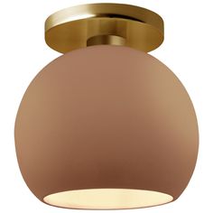 a round light fixture with a gold finish