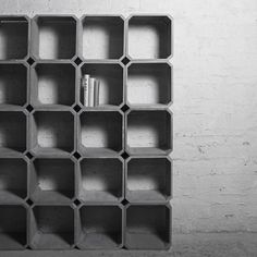 a book shelf made out of concrete blocks