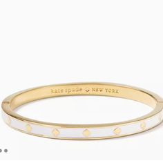 Brand New With Tags Kate Spade Spot The Spade Enamel Hinged Bangle Measurements Accessory Length (In): 2.25 In Band Width (In): 2.13 In Product Weight: 23.7g Inner Circumference: 2.25" Features Hinge With Push-Clasp Closure Plated Metal Polished Gold Colors: White, And Gold Gorgeous Kate Spade Bangle Bracelet, 2025 Wardrobe, Bday Wishlist, Kate Spade Bracelet, Jewelry Wishlist, Kate Spade Bangle, Bracelet Stacks, Gold Girl, White Bracelets