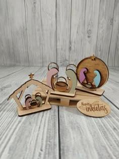 a wooden nativity scene with the birth of jesus