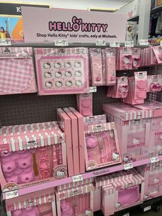 hello kitty toys are on display in the store for sale, with pink and white boxes