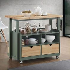 a kitchen island with drawers and plates on it