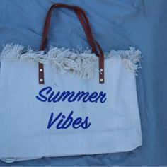 New With Tags Great Tote Size White Bag With Summer Vibes Embroidered In Navy Blue Material: Canvas Snap Closure 18.9 In (L) X 4.33 In (W) X 13.39 In (H) Summer Weekend Tote Shoulder Bag, Canvas Bag For Weekend In Summer, Summer Weekend Tote Bag, Spring Weekend Beach Bag In Summer Style, Casual White Embroidered Canvas Bag, Trendy White Beach Bag With Adjustable Strap, Trendy Summer Weekend Canvas Bag, Trendy Summer Canvas Bag For Weekend, White Canvas Bag For Weekend