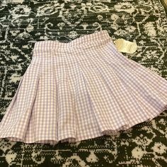 Stretchy Pleated Tennis Skirt In White And Purple Gingham Spring Cotton Pleated Skirt For School, Preppy Cotton Mini Skirt For Spring, Preppy Cotton Skirt, Preppy Short Cotton Skirt, Preppy Skirted Bottoms For Spring, Spring Cotton Pleated School Skirt, Fitted Plaid Tennis Skirt For Spring, Preppy School Bottoms For Spring, Preppy Cotton Tennis Skirt